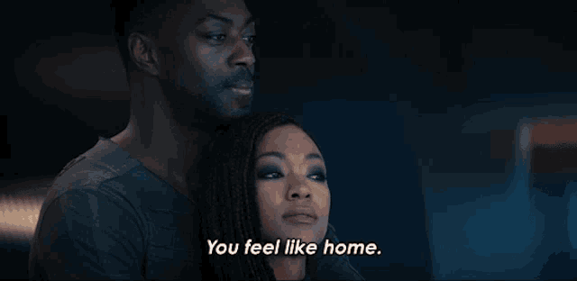 a man and a woman are hugging and the woman says you feel like home
