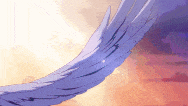 a close up of a bird 's wings against a pink and purple sky