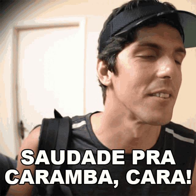 a man wearing a hat says saudade pra caramba cara !