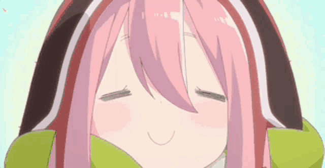 a close up of a pink haired anime girl with her eyes closed