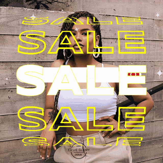 a woman is standing in front of a concrete wall with the words sale sale in yellow letters