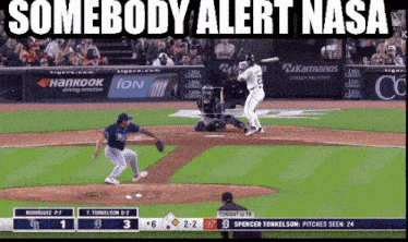 a baseball game is being shown on a screen with the words somebody alert nasa