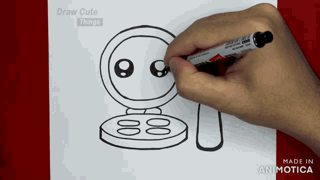 a person is drawing a makeup palette with a marker on a piece of paper