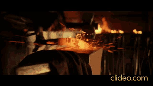 a close up of a fire with the website clideo.com in the lower right corner
