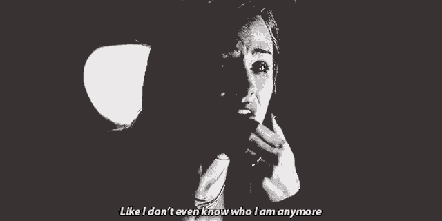 a black and white photo of a woman with her eyes closed and the words `` like i don t even know who i am anymore ''
