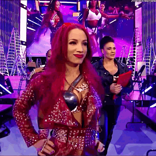 a woman with red hair and a necklace that says ' smackdown ' on it