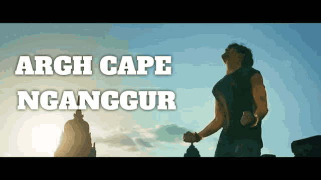 a man stands in front of a building with the words arch cape nganggor written above him
