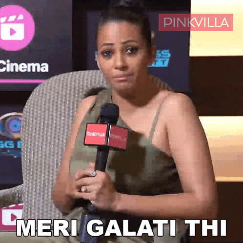 a woman holding a microphone with the words meri galati thi written on it
