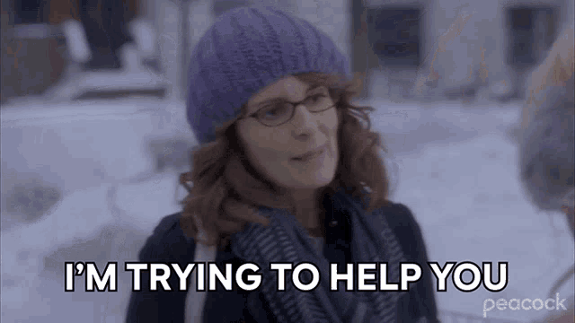 a woman wearing a purple hat and scarf is saying i 'm trying to help you