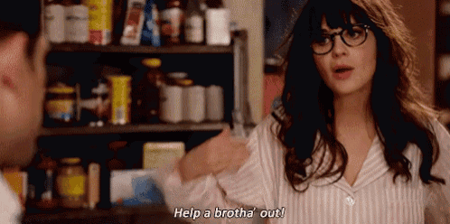 a woman wearing glasses is talking to a man in a kitchen and says help a brotha out .