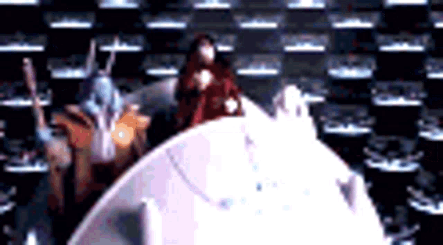 a group of robots are standing next to each other in a room .