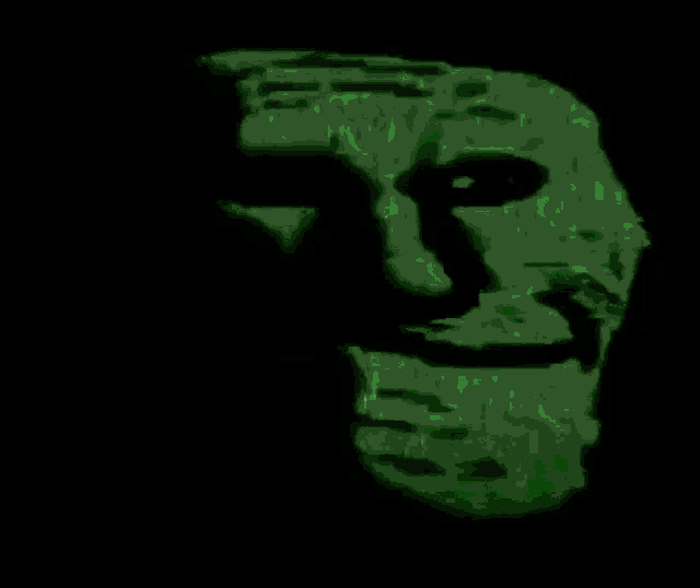 a green glowing face is against a black background