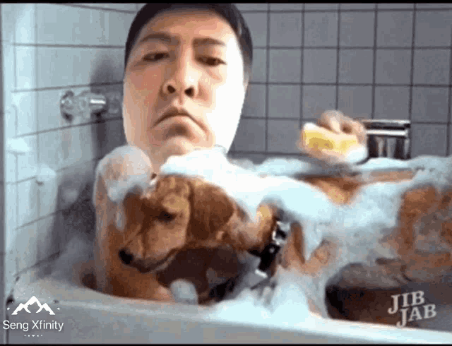 a man is taking a bath with a dog and sing xfinity is on the bottom