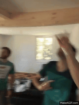a group of people are dancing in a room with a makeagif.com link