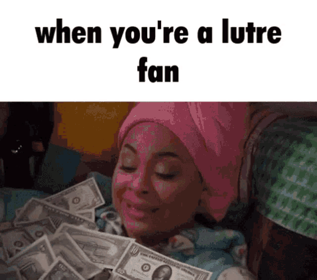 a woman with a towel wrapped around her head is laying on a bed with a pile of money .