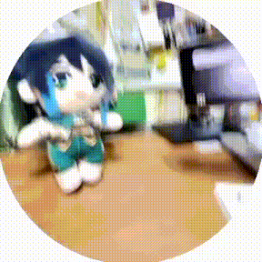 a stuffed animal is sitting on a wooden table