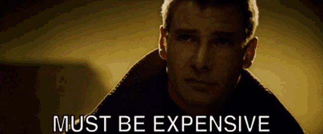 a man with the words must be expensive written above him