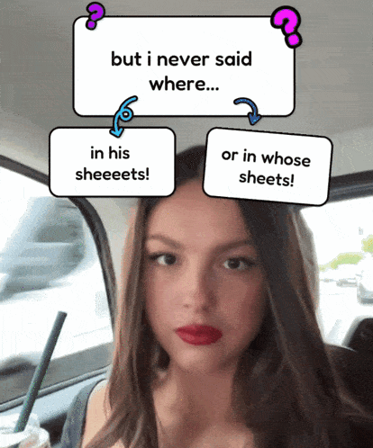 a woman in a car with a sign that says " but i never said where "