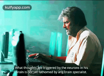a man is sitting in front of a computer with a caption that says what thoughts are triggered by the neurons