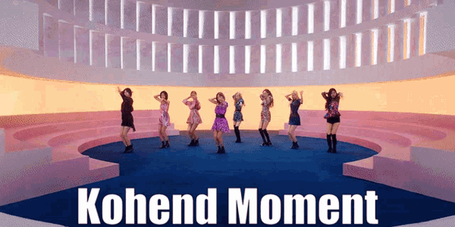 a group of women are dancing in a circle with the words kohend moment written on the bottom