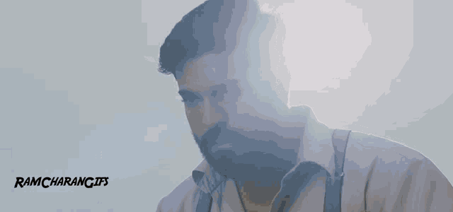 a close up of a man 's face with the words ramcharangifs written on the bottom