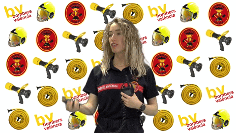 a woman in a bombers valencia uniform is holding a radio