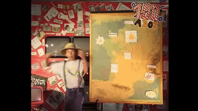 a man in a hat stands in front of a map that says ' a808 ' on it