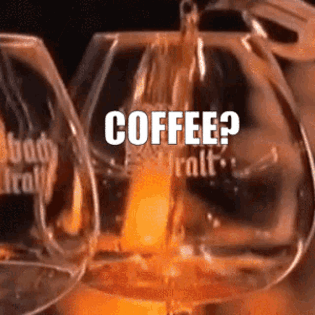 a glass with the word coffee on it is being poured into another glass