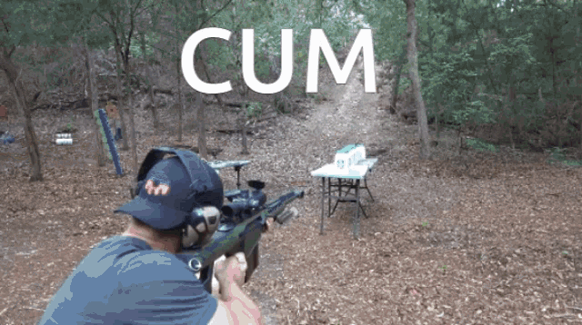 a man holding a rifle with the word cum written above him