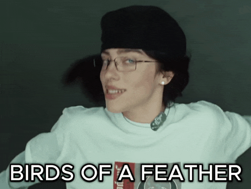 a woman wearing glasses and a hat with the words " birds of a feather " above her