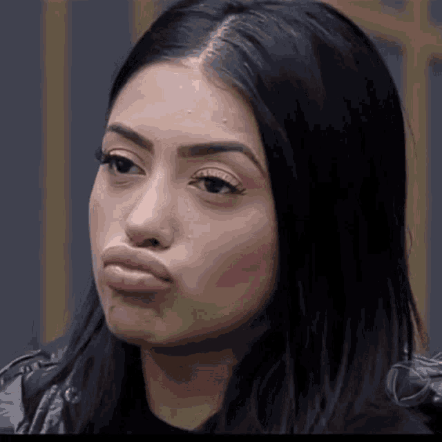 a close up of a woman making a funny face with her mouth open