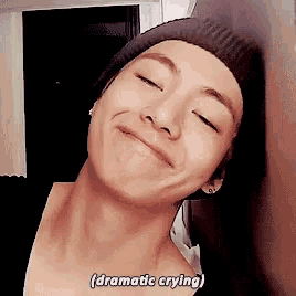 a close up of a person 's face with the words dramatic crying written on the bottom