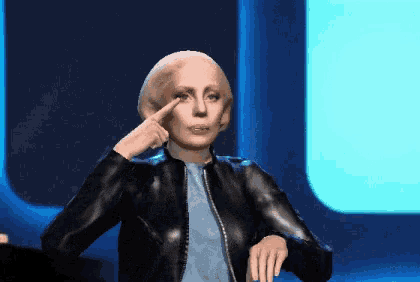 a woman in a black jacket is pointing her finger to her eye