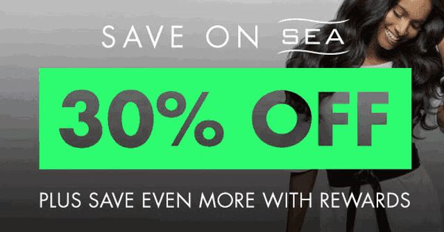 a woman is smiling in front of a sign that says 30 % off plus save even more with rewards