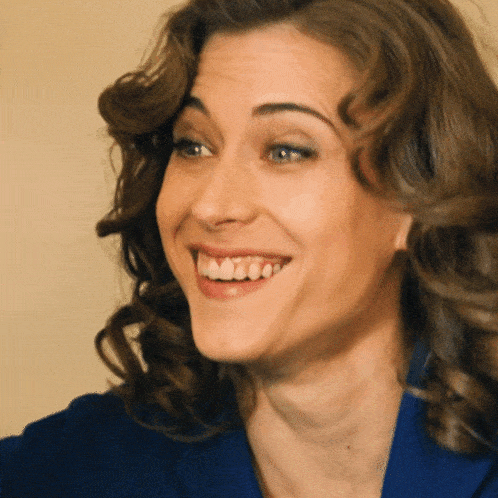 a close up of a woman 's face with her mouth open