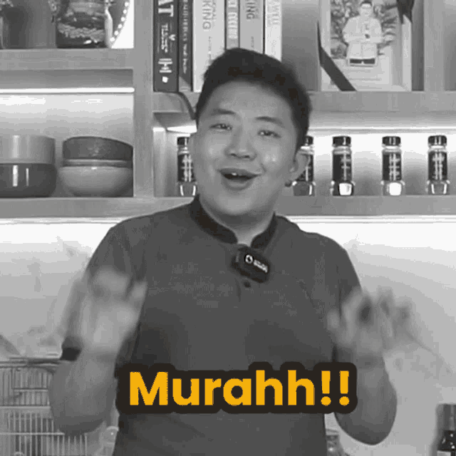 a man stands in front of a bookshelf with the word murahh on the bottom