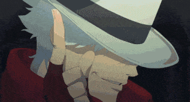 a man wearing a white hat and a red jacket holds his finger to his ear