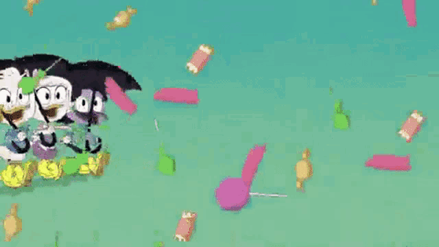 a group of cartoon characters are standing next to each other in a field surrounded by candy .
