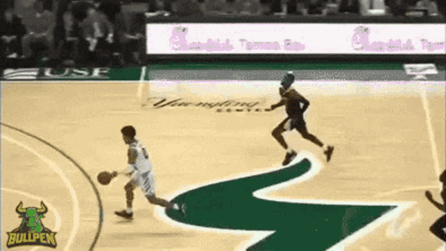 a basketball game is being played on a court with a bullpen logo