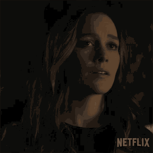 a close up of a woman 's face with netflix written in the corner