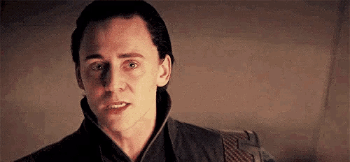 a close up of a man 's face with a serious expression .