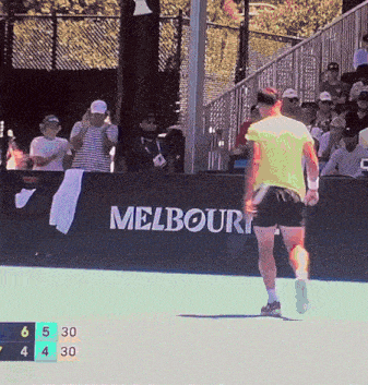 a melbourne sign is behind a tennis player on a court