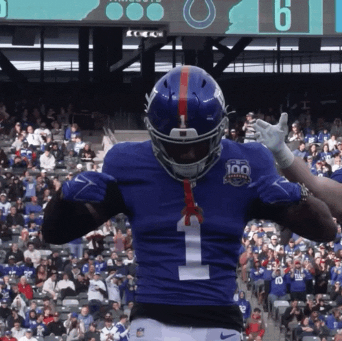 a new york giants football player wearing number 1