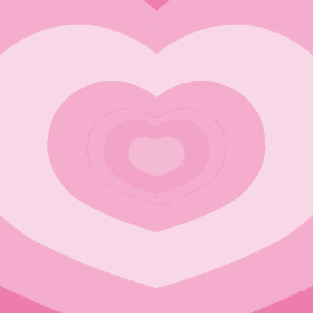 a pink heart on a pink background with a heart in the middle .