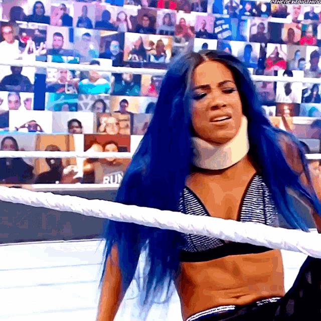 a woman with blue hair wearing a neck brace