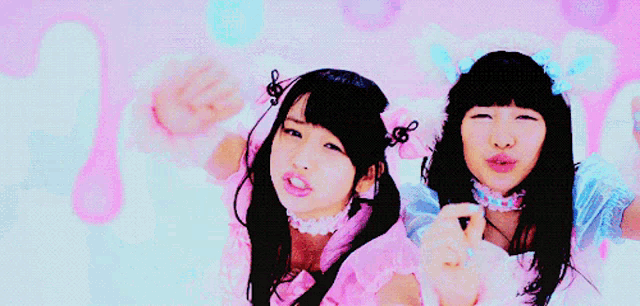 two girls wearing bunny ears and bows on their heads