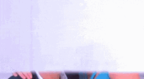 a man and a woman are kissing under a white sheet .