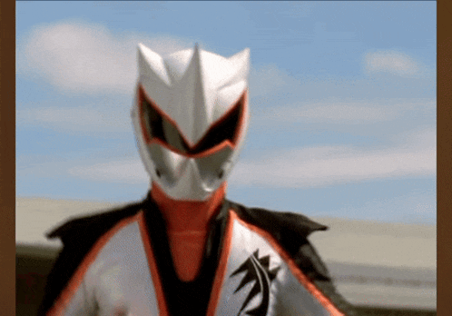 a superhero with a white helmet and red and black costume
