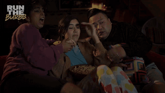 a group of people sitting on a couch with the words run the burbs on the bottom right