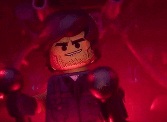 a close up of a lego man 's face with an angry expression
